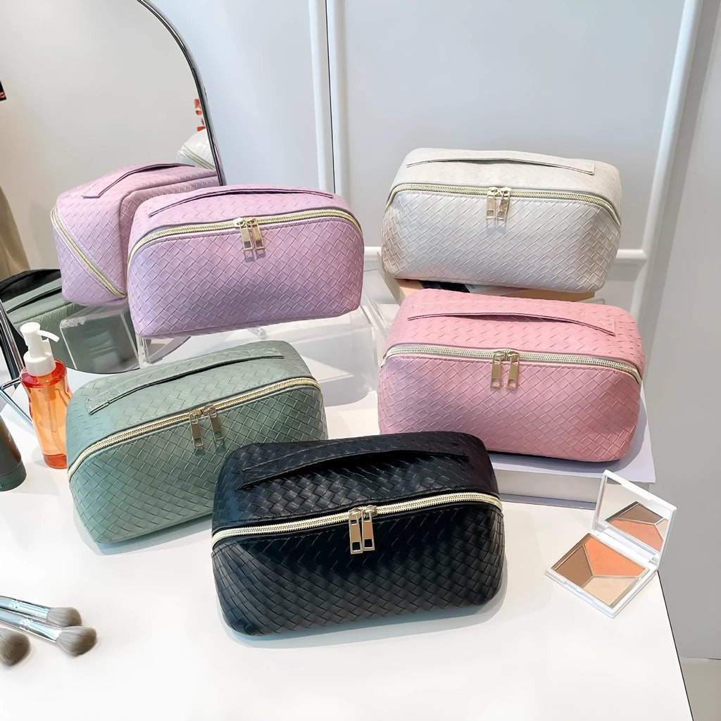 Waterproof large capacity PU storage bag in white, open showing cosmetics inside