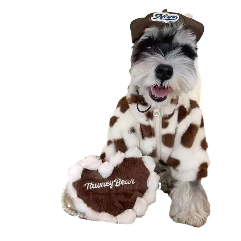 Small dog wearing plush warm coat in pink colour for cold weather protection