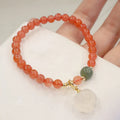 Women's natural red agate bracelet with 8mm cat's paw charms and complementary jade bracelet