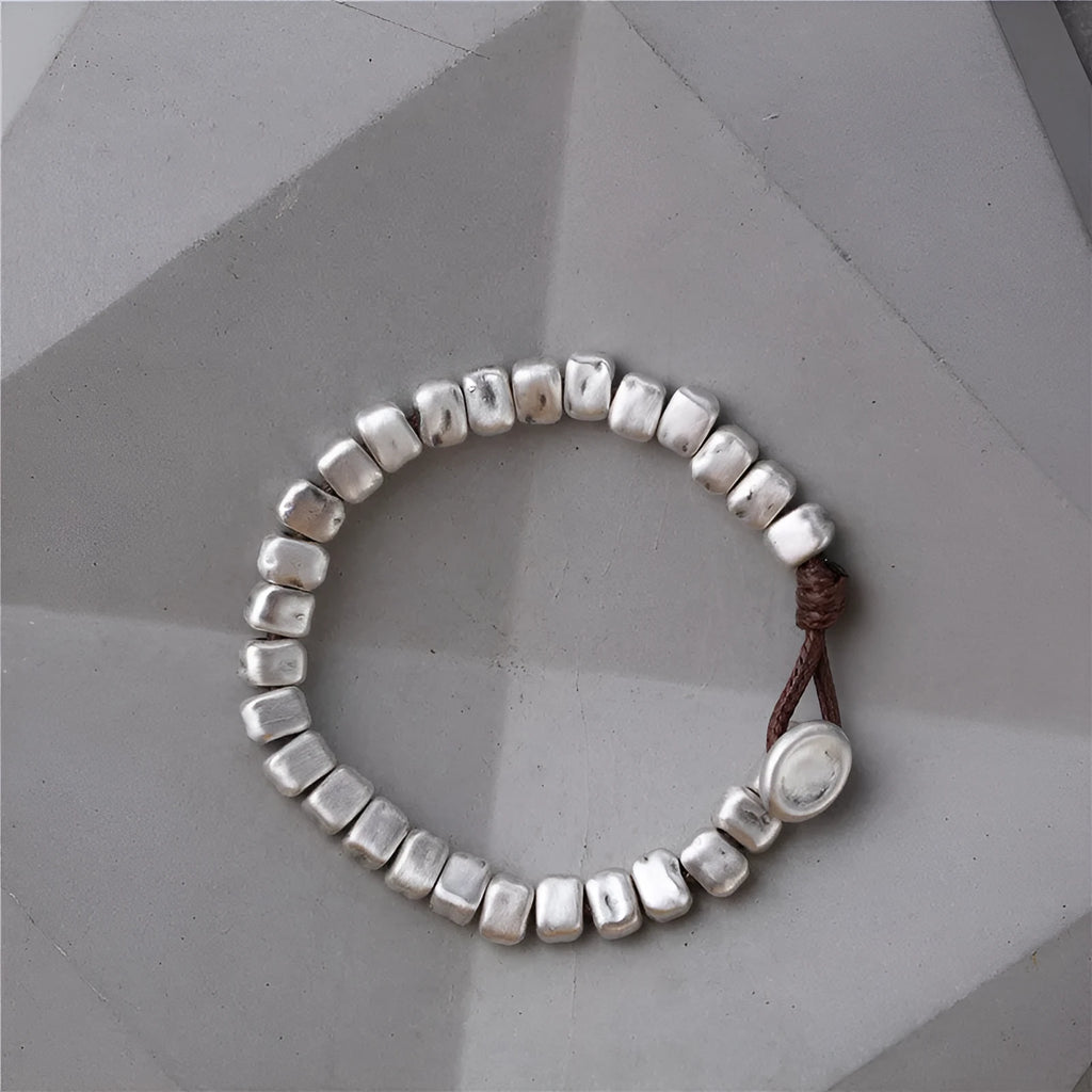 Handmade women's bracelet with irregular silver squares on wooden beads and elastic band