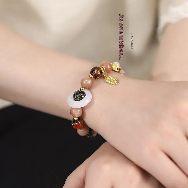 Hand-woven fragrant grey coloured glaze bracelet with sunstone or white lip shell beads