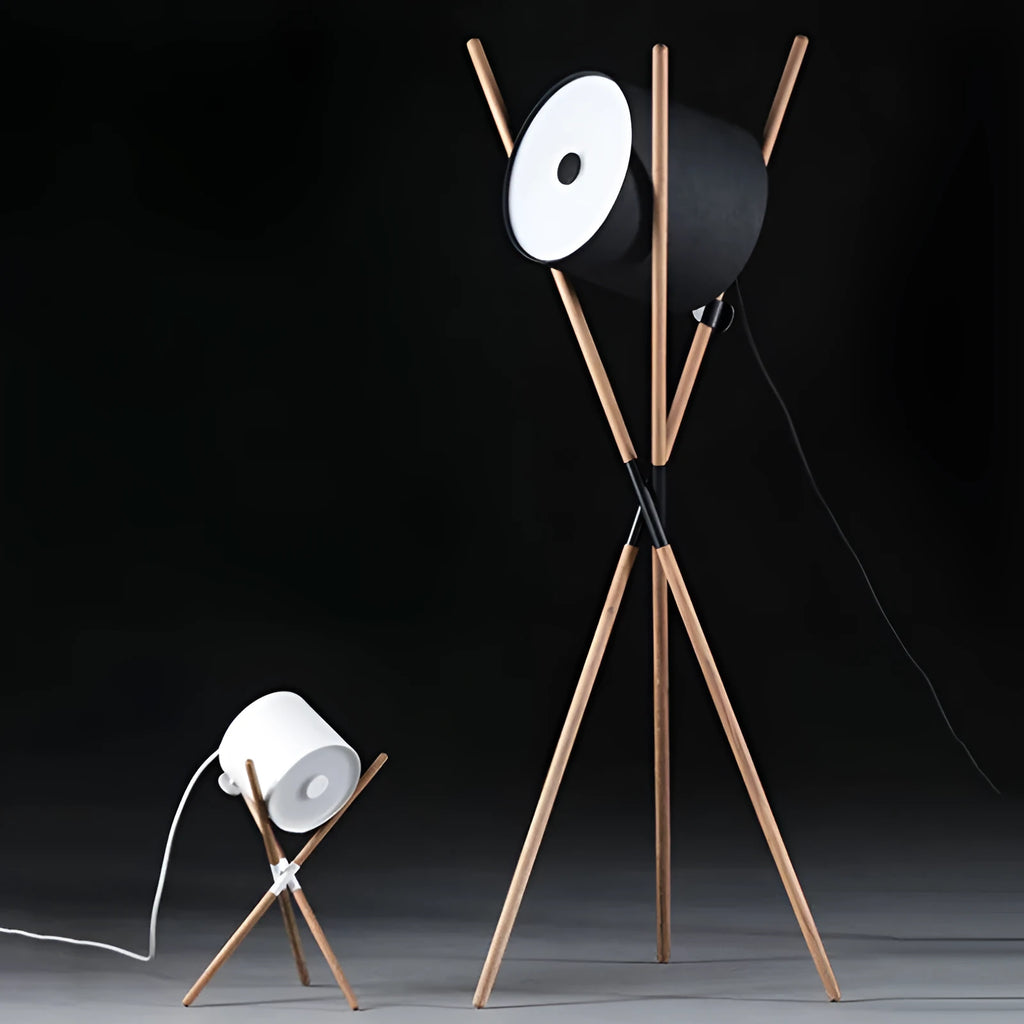 Modern wooden three-prong floor lamp with an acrylic shade in a living room setting.