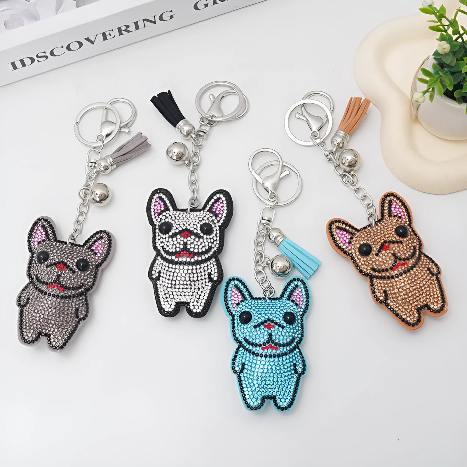Cartoon dog alloy keychain pendant with rhinestones and bag tassel in caramel colour.