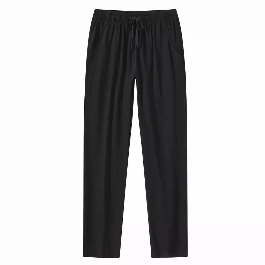 Men's loose-fitting cotton linen casual trousers in khaki colour on a neutral background.