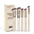 Five apricot coloured angled makeup brushes with synthetic bristles for foundation and powder application