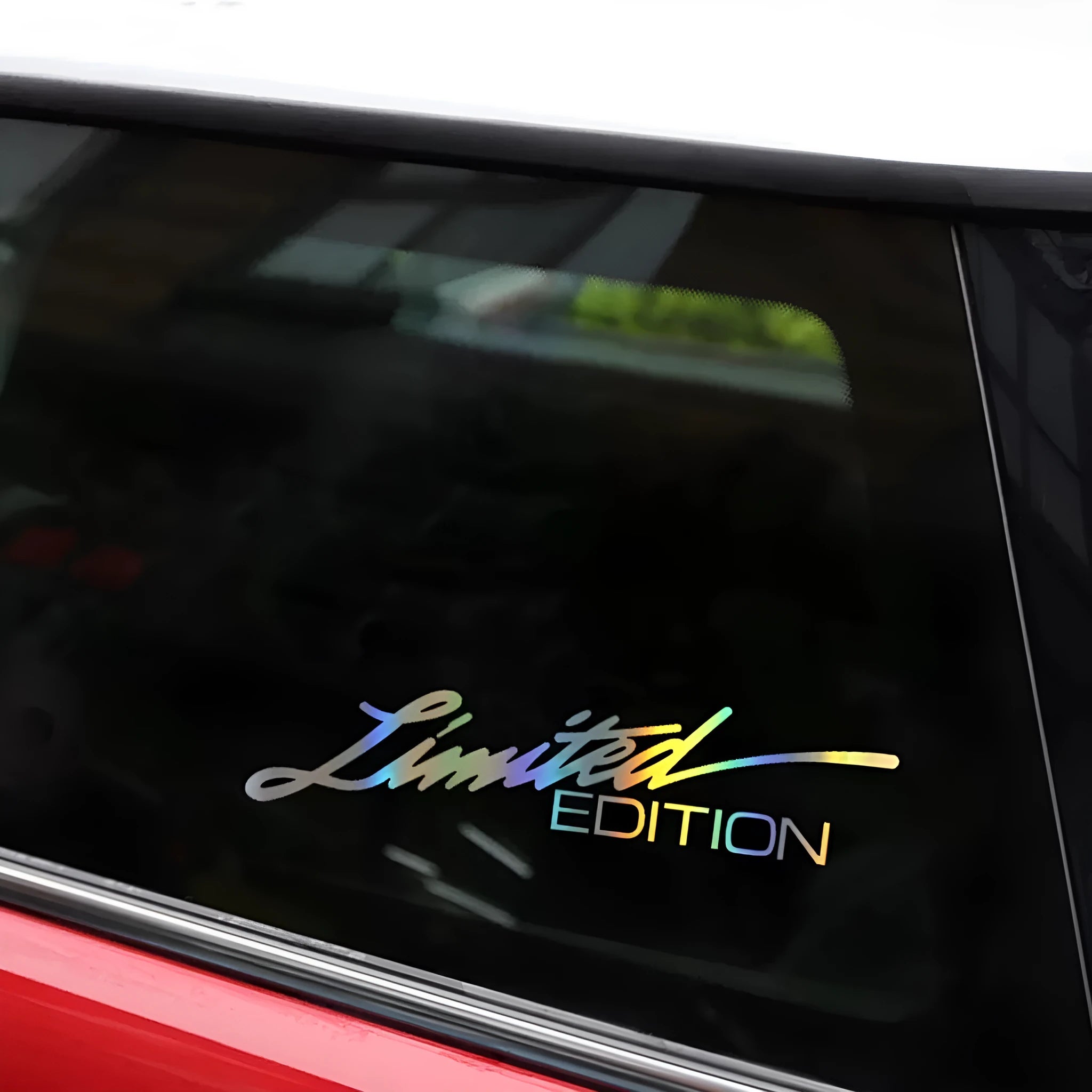 Black laser reflective vinyl car sticker with text, shown on a roll for a vehicle window.
