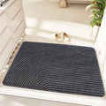 Green alien-shaped floor mat with cartoon anime pattern, dimensions 60 by 90 centimetres.