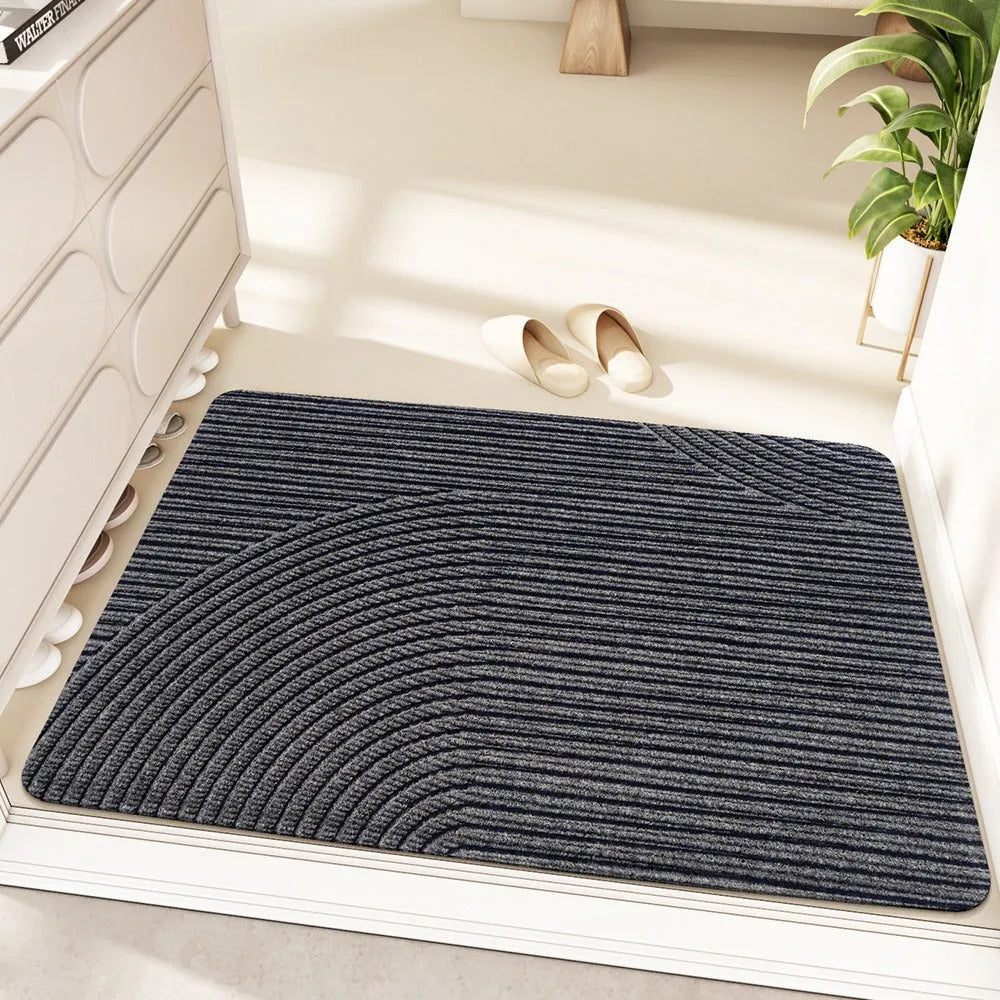 Green alien-shaped floor mat with cartoon anime pattern, dimensions 60 by 90 centimetres.