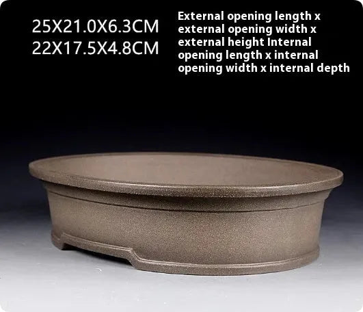 Handmade purple sand clay oval bonsai flower pot showing antique shape and 25x21x6.3cm dimensions