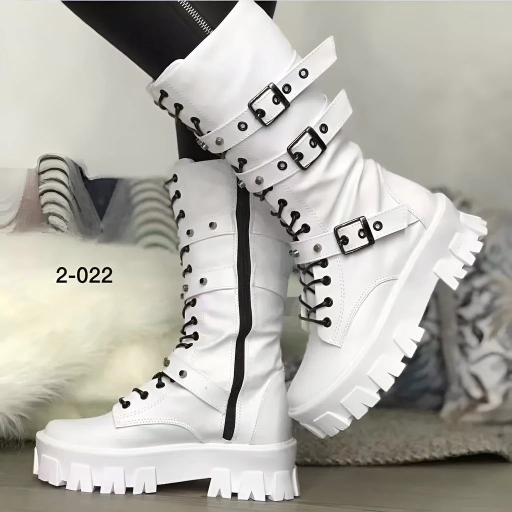 A pair of women's black mid-calf knight boots with a side zip and a large metal buckle strap.