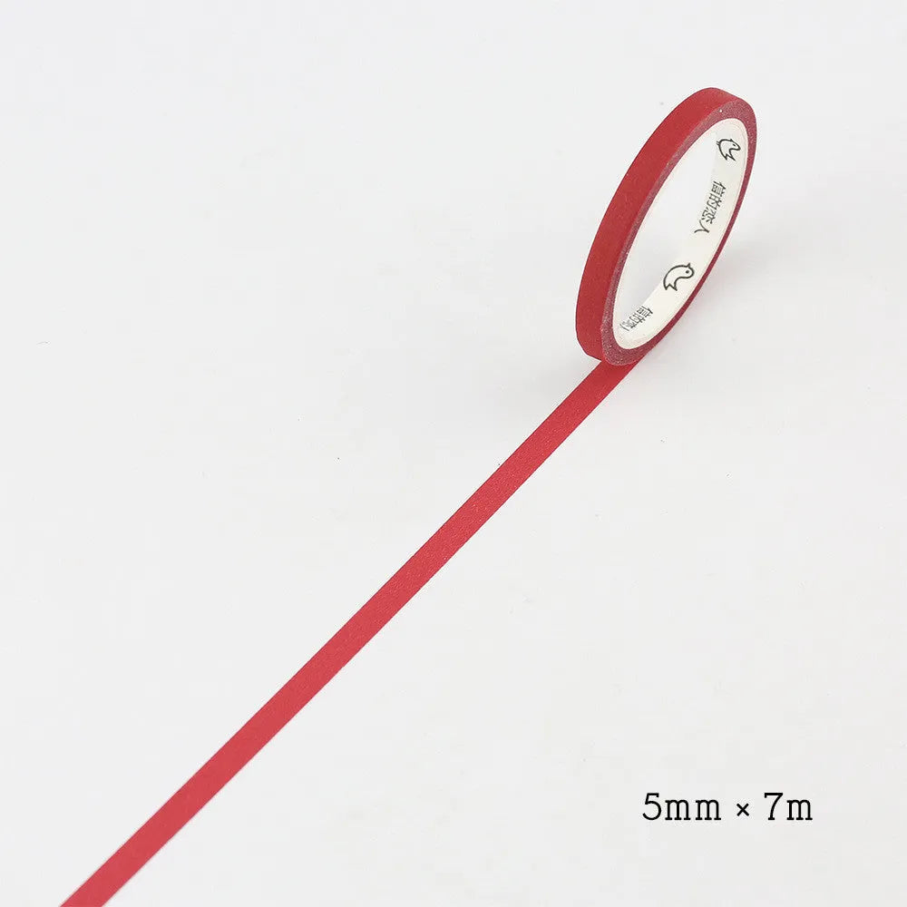 Roll of solid colour paper tape in crimson or deep purple, showing 5mm width stationery tape for organisation