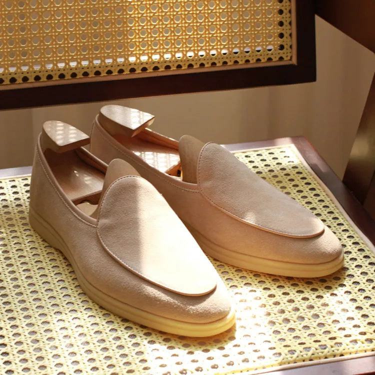 British handmade men's genuine leather loafers in various colours on a flat shoe sole.