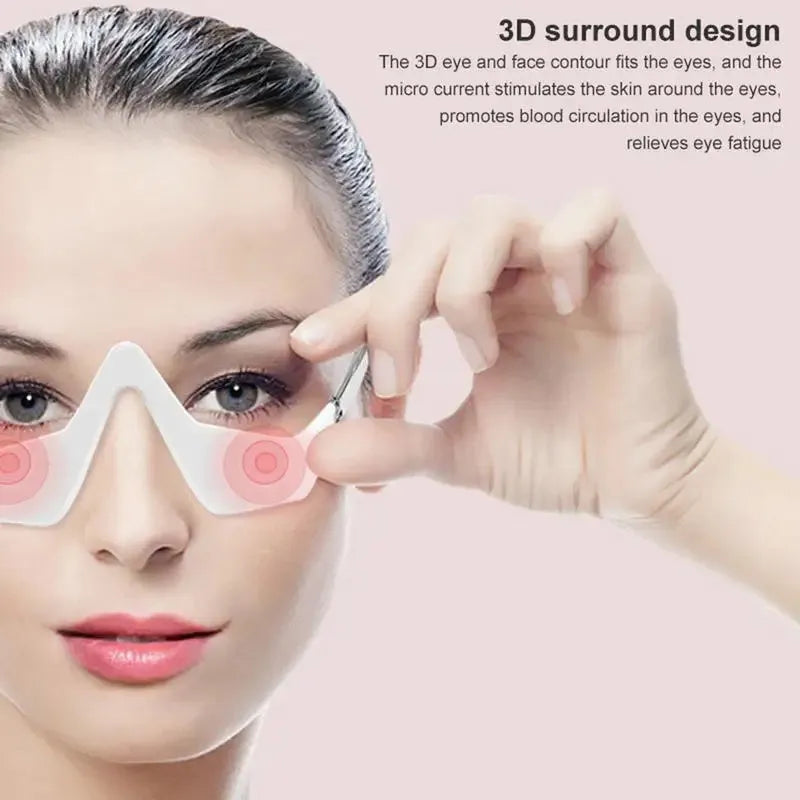 Pink and white micro-current eye massager with glasses-style design