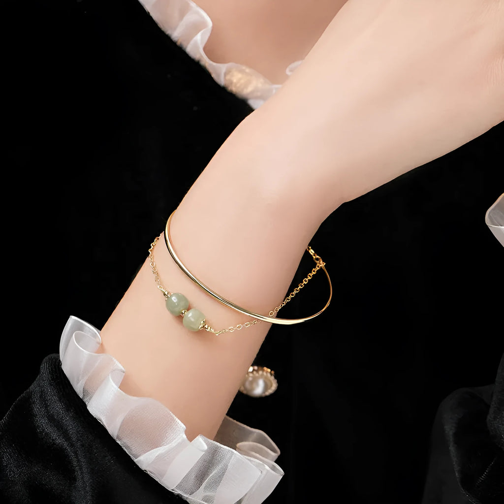Women's Hetian jade lucky bracelet with gold inlay in single, double, and three bead styles.