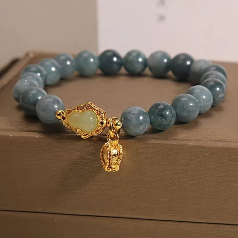 Women's natural stone bracelet with lotus flower gourd pendant in sky blue colour