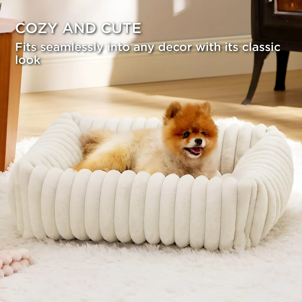 Beige removable cover pet bed for a medium-sized dog on a wooden floor.
