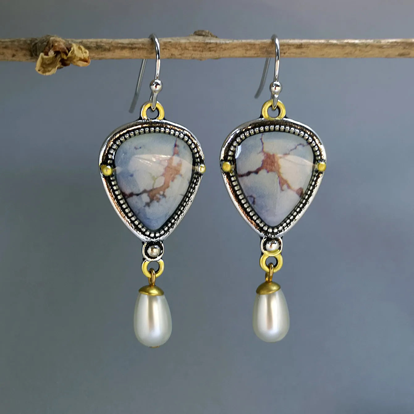 Blue retro bohemian drop earrings with synthetic opal and pearl details on electroplated metal