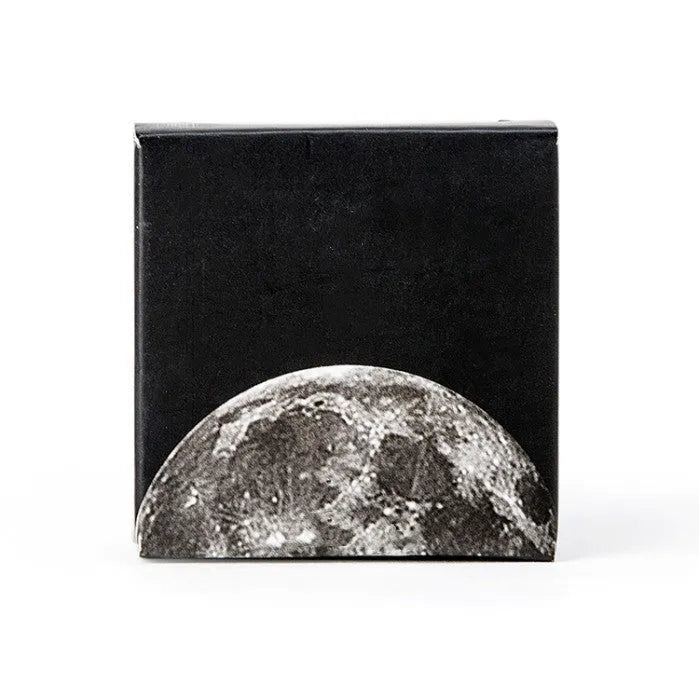 Black moon phase, planet, and calendar design stickers on a sheet, 45 pieces total.
