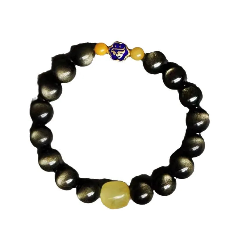 Handmade golden obsidian bracelet with 10mm geometric beads on a wrist, showing ethnic zodiac design.