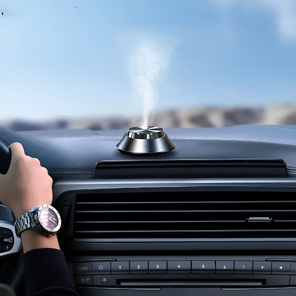 Black car aromatherapy diffuser with metal butterfly design and USB power cable for vehicle use