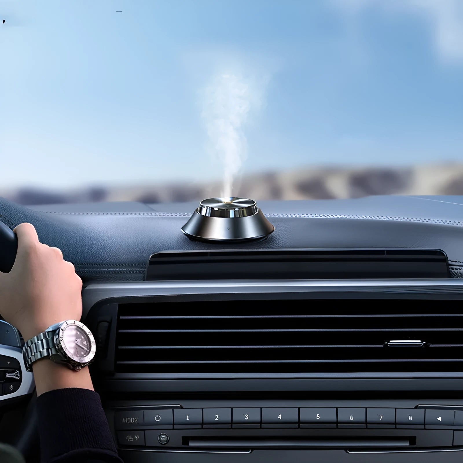 Black car aromatherapy diffuser with metal butterfly design and USB power cable for vehicle use
