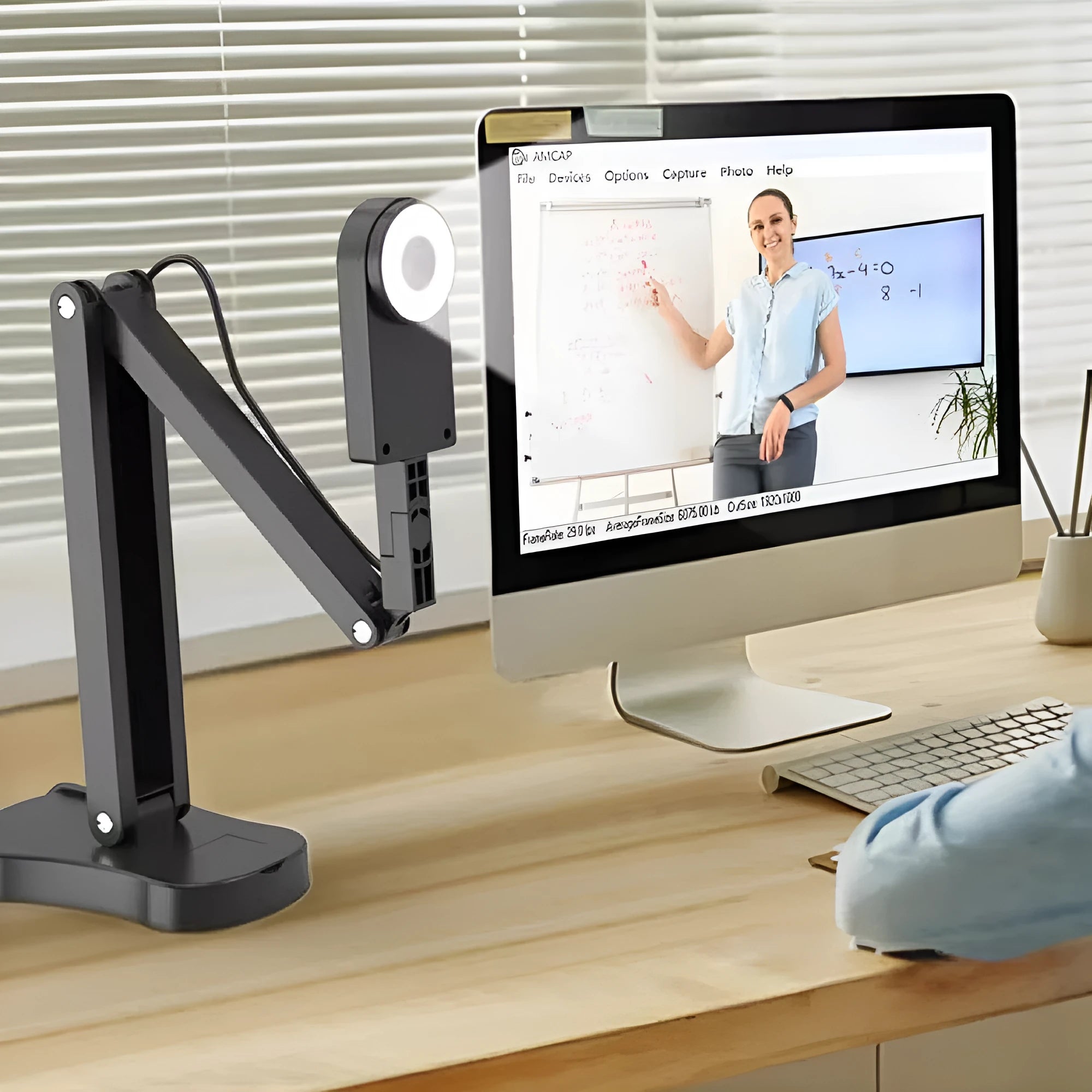 USB computer webcam with a built-in microphone on a desk, showing different model options with remote controls and cables.