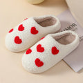 Women's plush cartoon love style home slippers in multiple colours with a non-slip PVC sole.