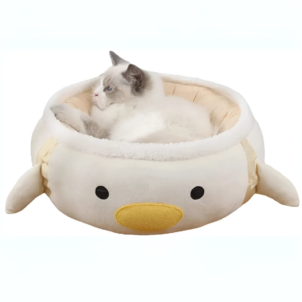 Green chick-shaped cat bed shown both flat and hanging as a hammock, for small pets.