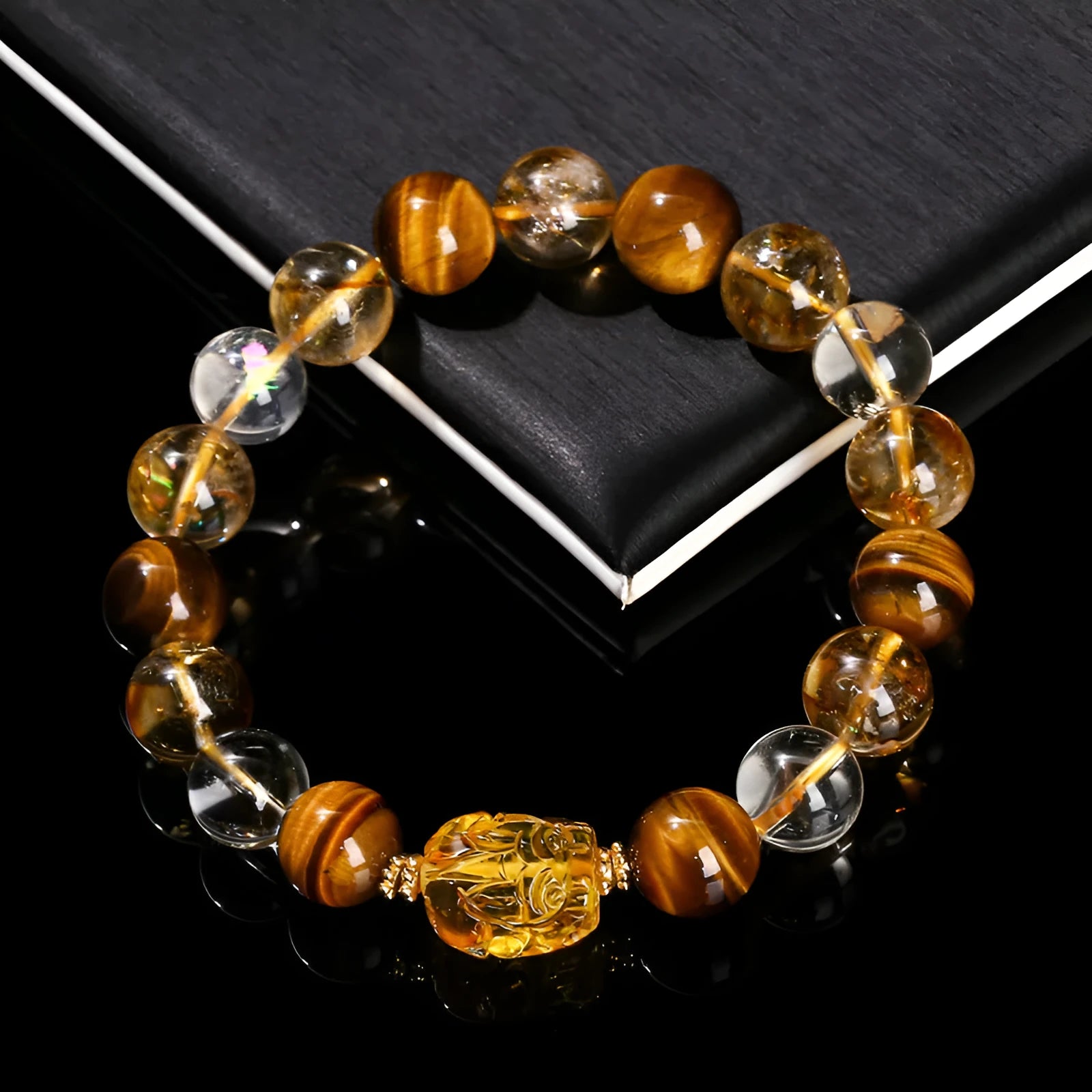 Yellow tiger's eye and citrine gemstone bracelet with 10mm round beads and a silver steel Pi Xiu charm.