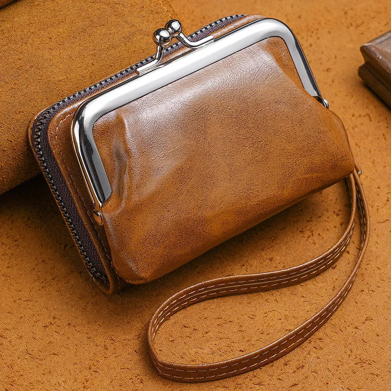 Ladies coin purse with a metal buckle and a long silver clip, shown in a selection of colours.