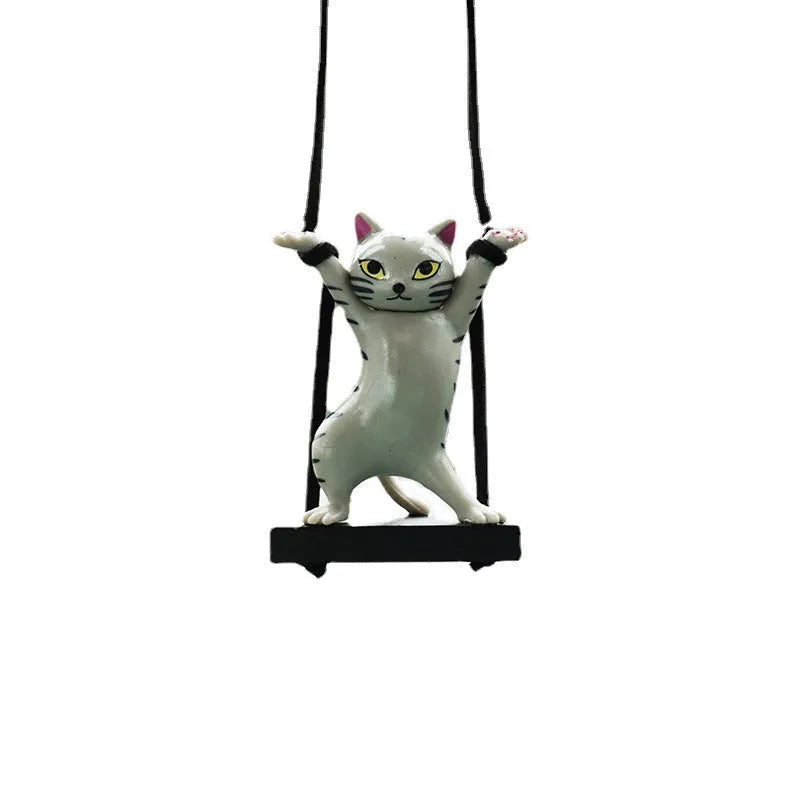 Cartoon-style resin cat pendant for car interior decoration with adjustable rope.