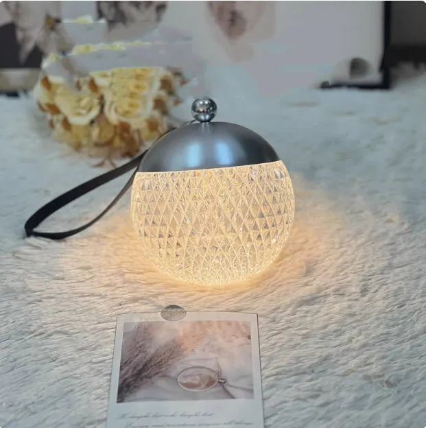 Small round touch-controlled desk lamp in aluminium and acrylic with dimmable LED lighting