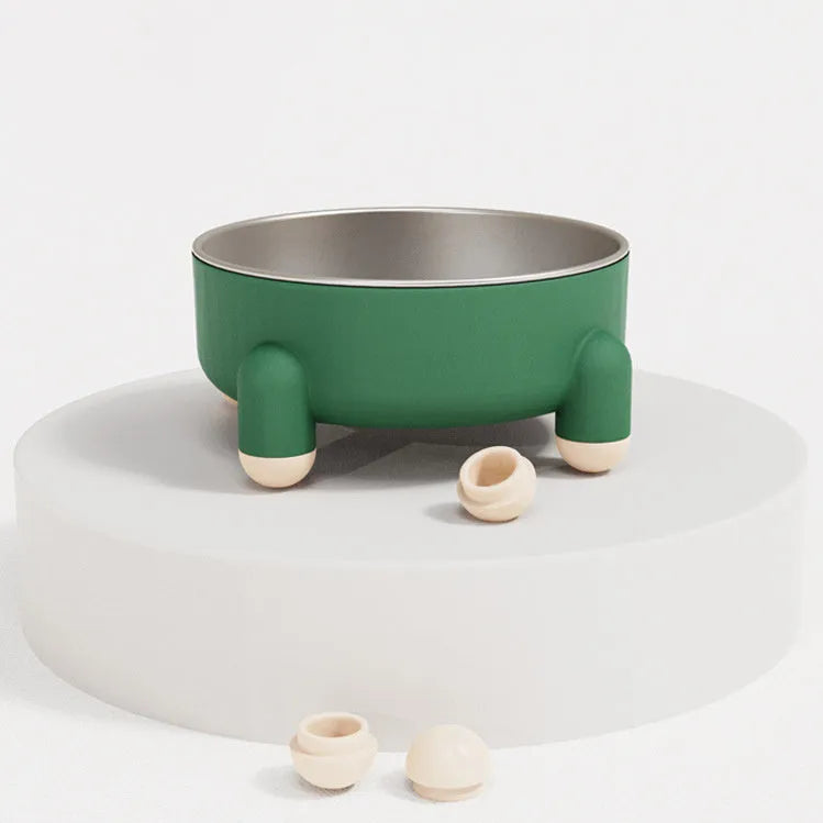 Green stainless steel pet bowl with non-slip base and high foot on a kitchen floor.
