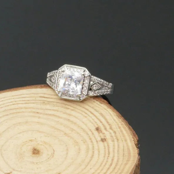 Geometric hollow design zircon ring with platinum colour finish on copper band