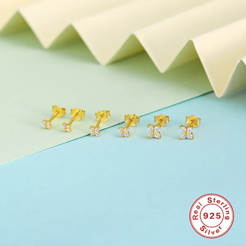 S925 sterling silver petal crystal flowers stud earrings in golden or platinum colour on a white background.
