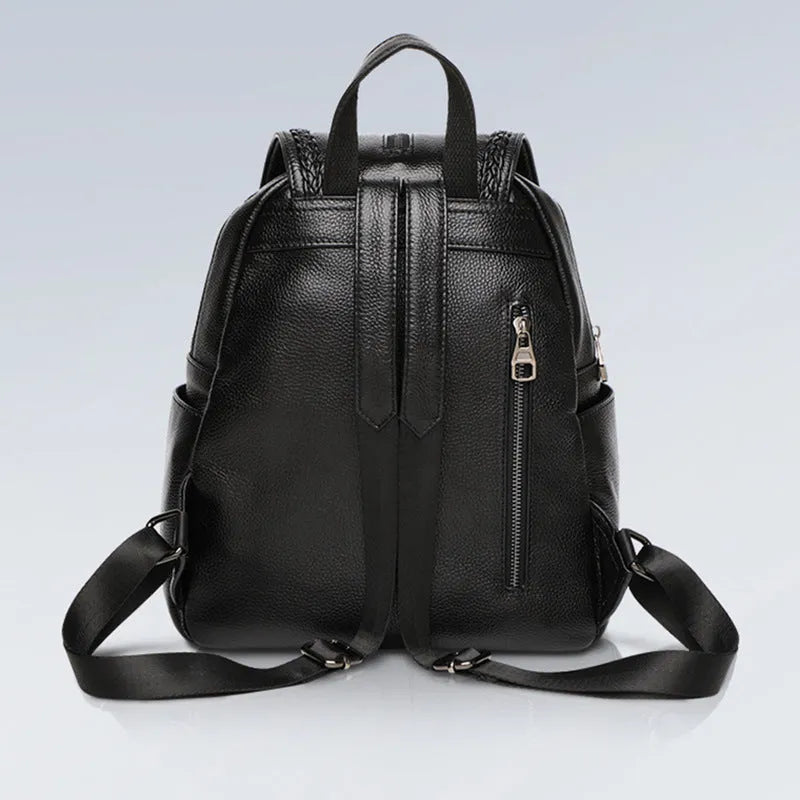 Blue genuine leather street trend women's backpack showing external sandwich pocket and zipper.