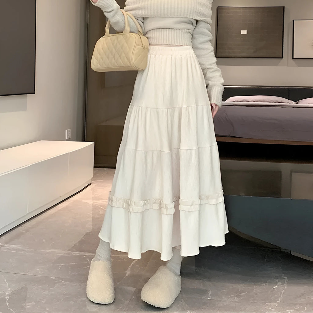 Women's corduroy A-line midi skirt with elastic waistband in milky white, black, or brown colours