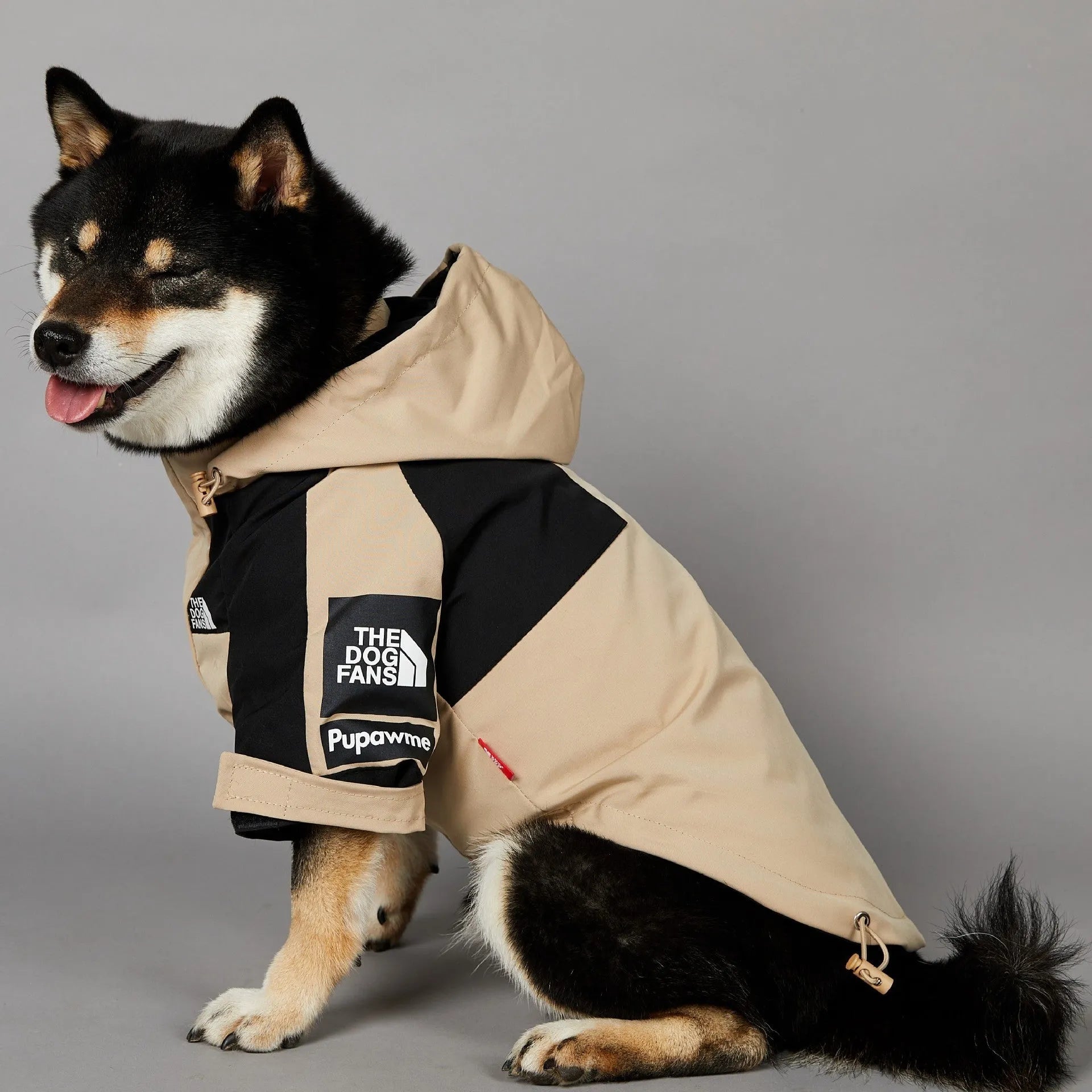 Khaki coloured polyester dog shell jacket shown on a model dog.