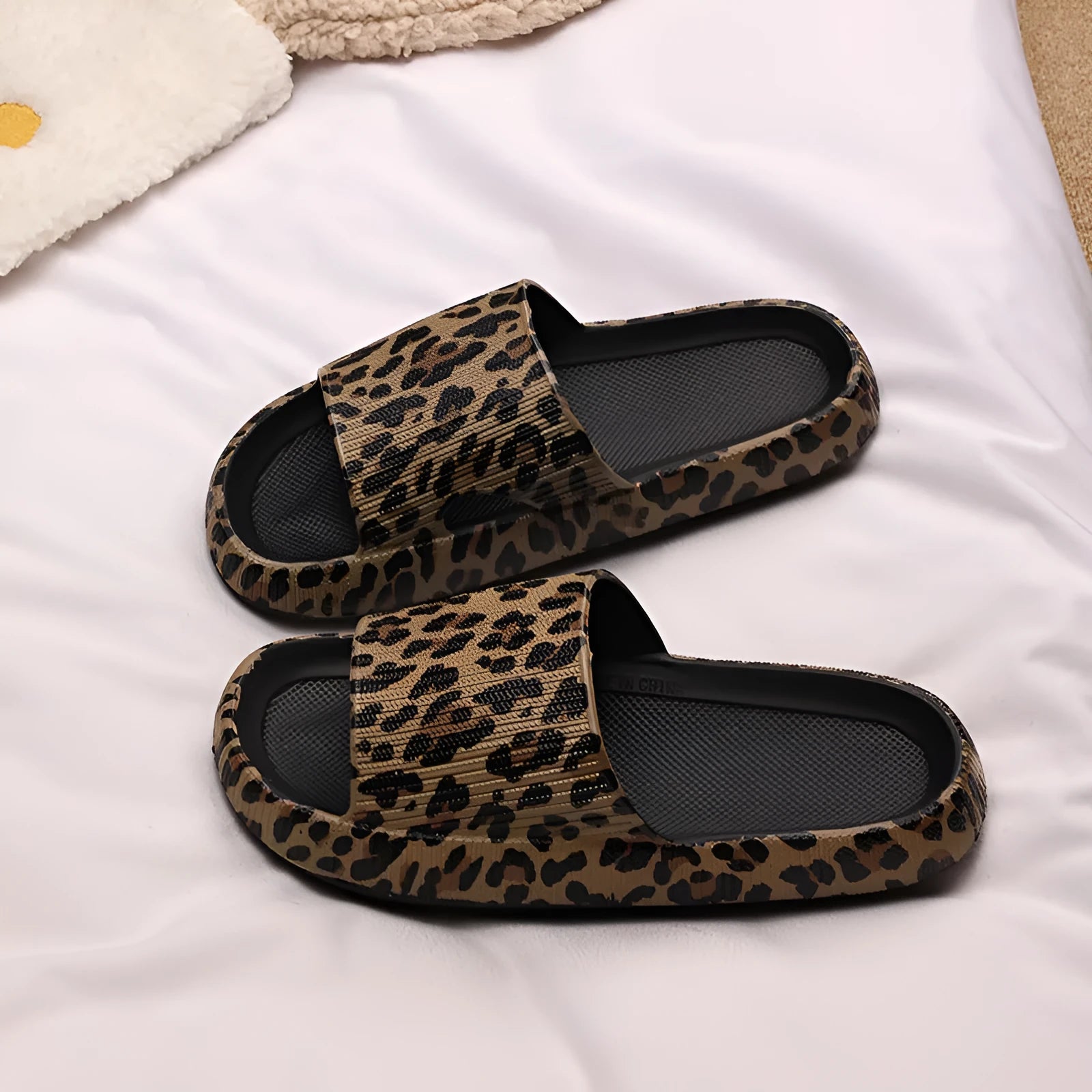 Women's leopard print EVA slippers with thick sole on a white background
