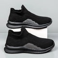 Men's solid colour casual sneakers with fabric popcorn flyknit upper and low-top design.