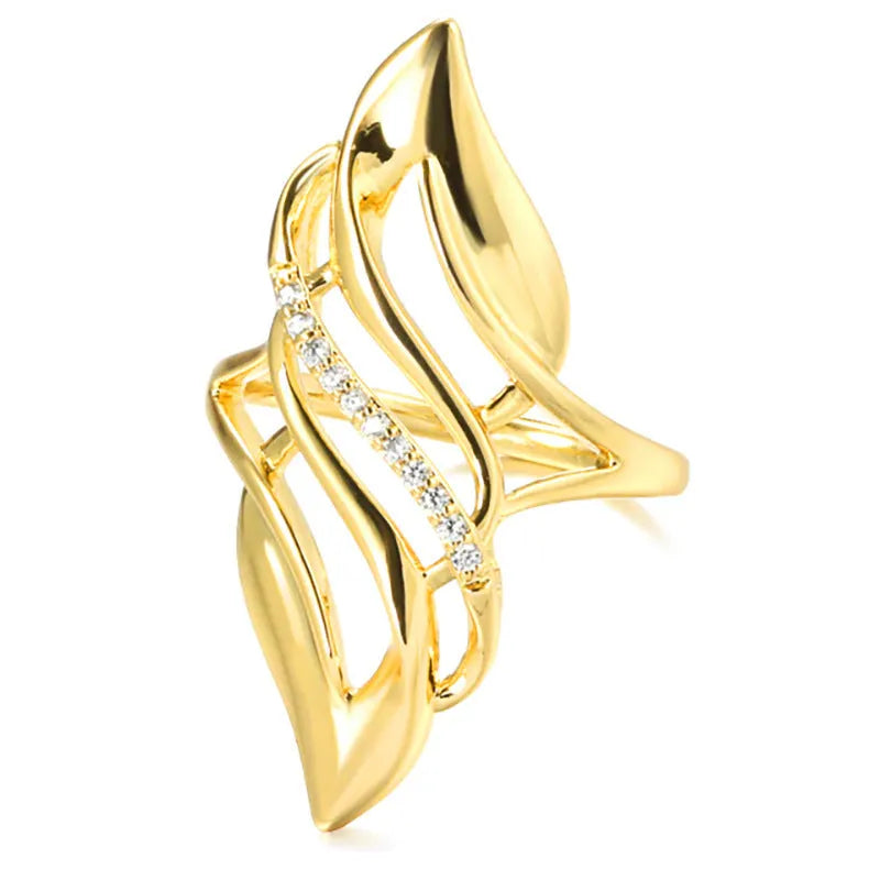 Women's copper ring with exaggerated curved design and gold-coloured finish showing side profile