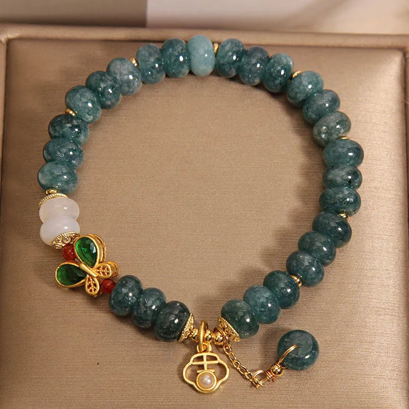 Women's blue water jade abacus bead bracelet with alloy inlay and white agate accents