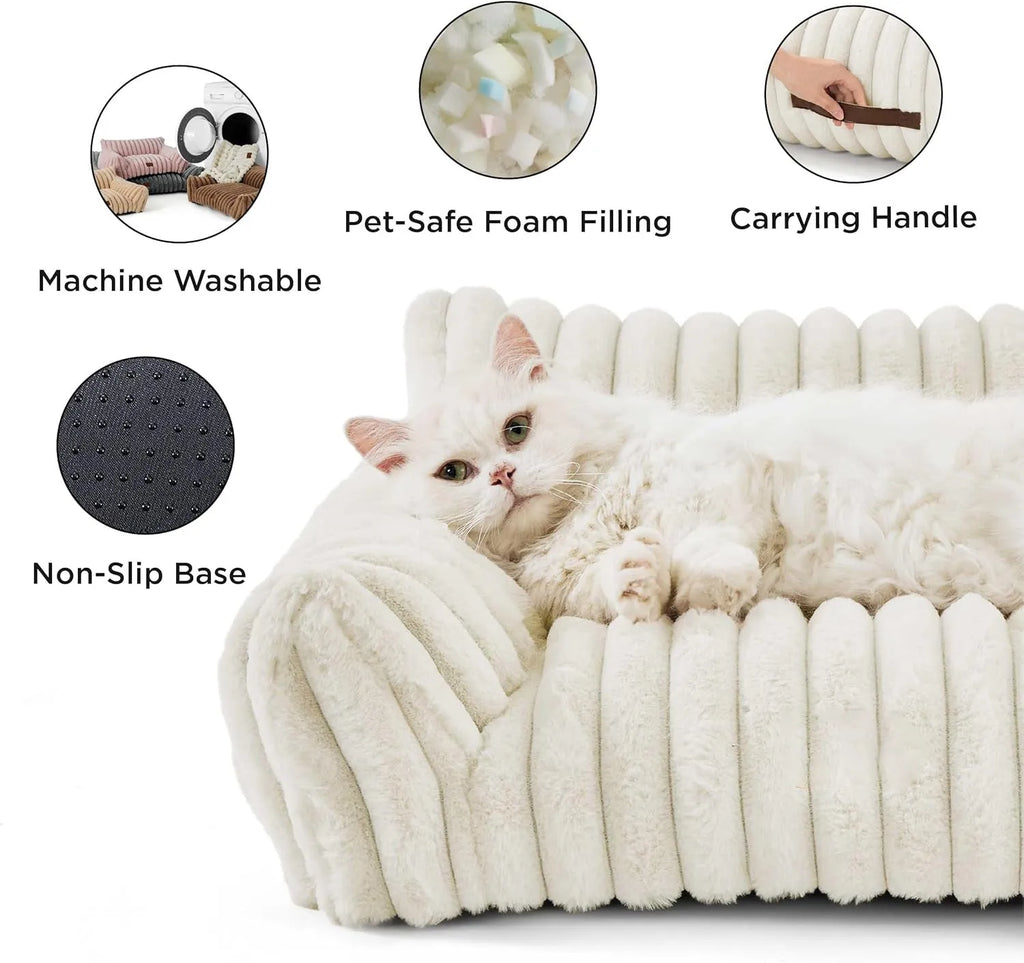Beige corduroy fleece pet couch with high backrest and sides on a wooden floor.