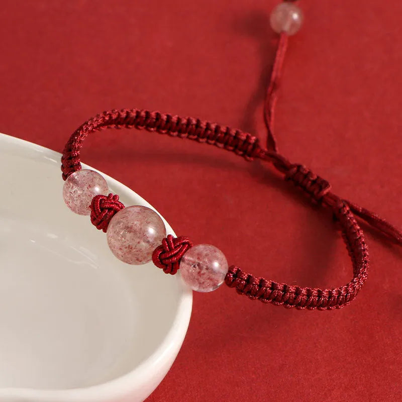 Woven red rope bracelet with spherical natural stone beads and alloy clasp