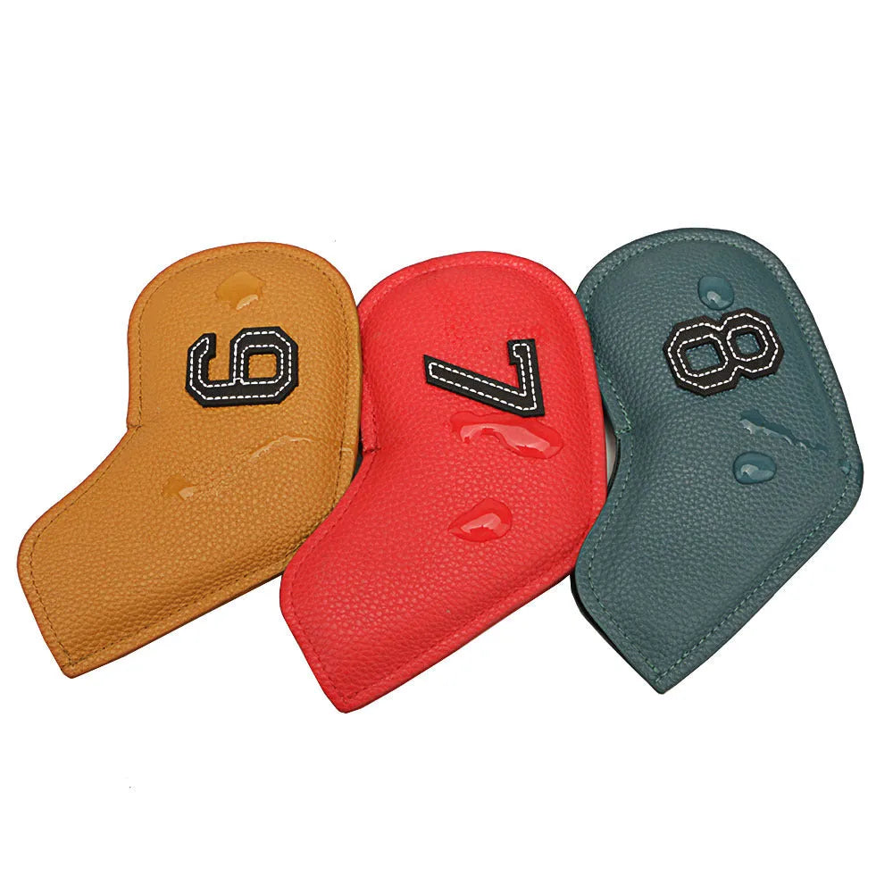 Set of 10 multi-coloured PU golf club head covers with ball head design on a golf bag.