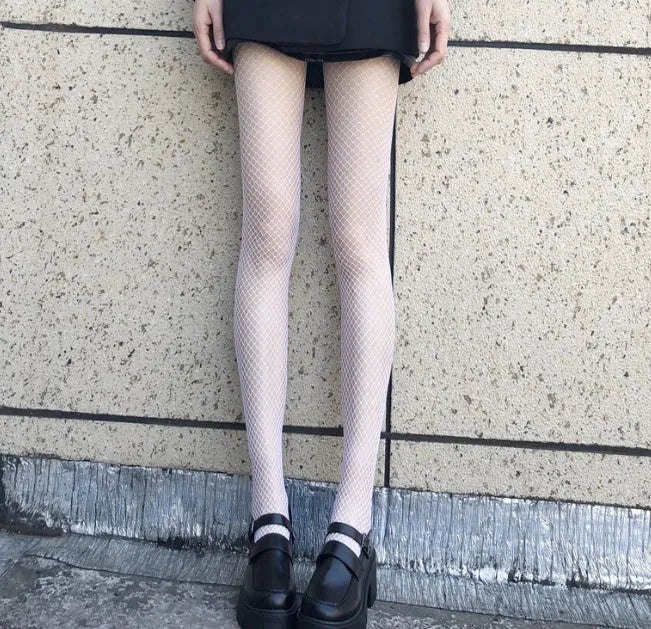 Women's summer mesh stockings showing large, medium and small pattern variations in black and white colours