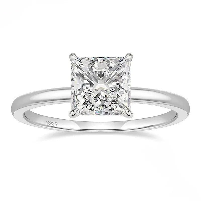 Women's simple geometric 925 sterling silver ring in gold, rose gold, or silver colour on a grey background.