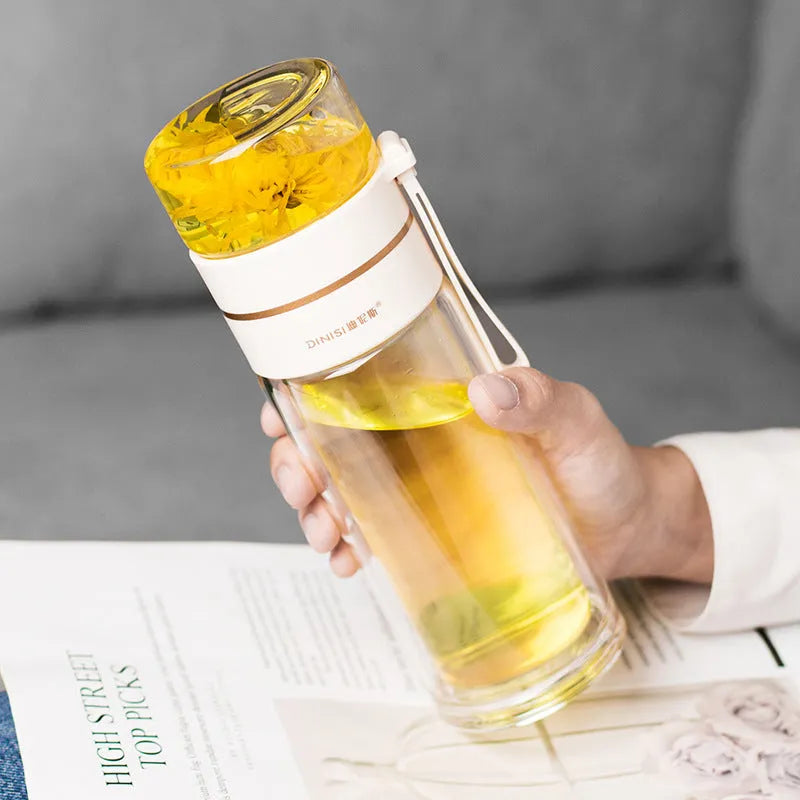 Double wall glass tea infusion bottle with stainless steel filter and rope handle in various colours.