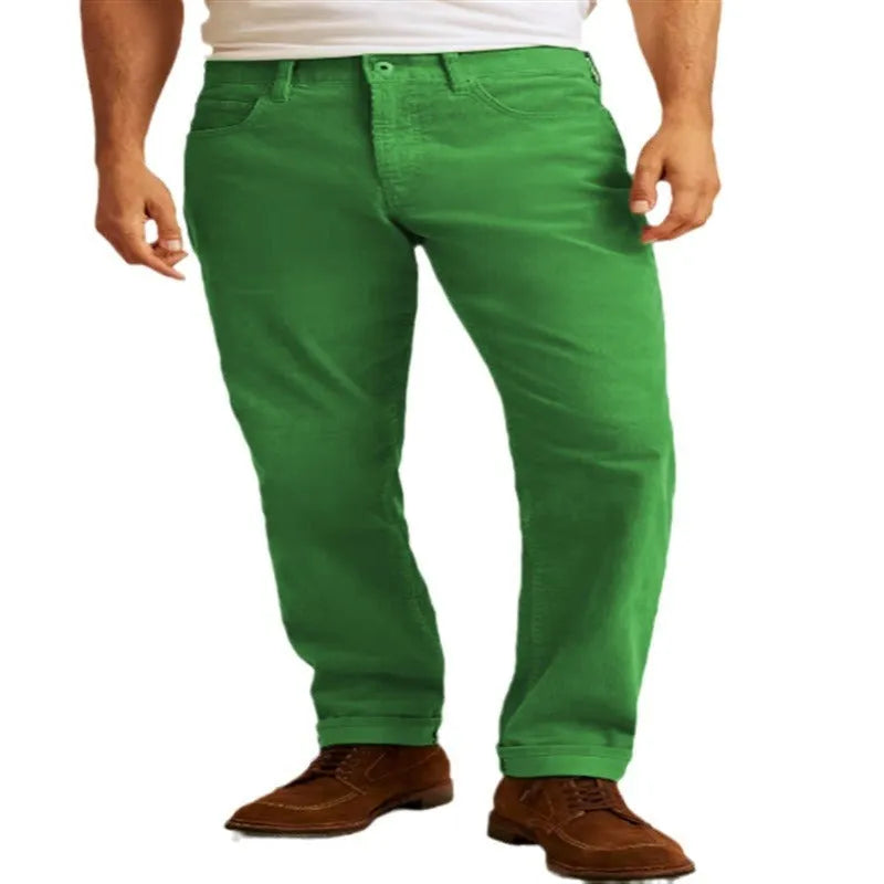 A pair of loose straight-leg corduroy trousers in an army green colour, laid flat.