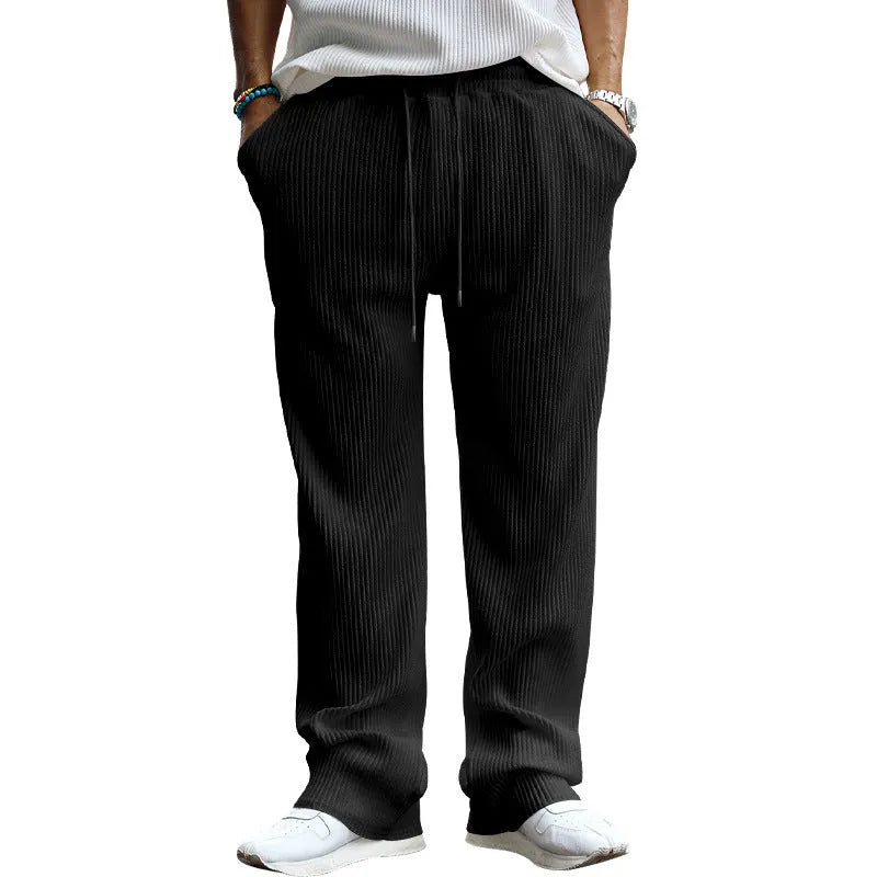 Men's loose fit high waist straight leg casual trousers in khaki colour on a hanger.